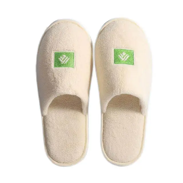 Light yellow monogram embroidered logo hotel slippers